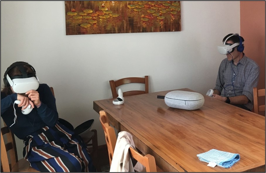 A photograph of two Congress participants using virtual reality to explore the atomic details of the voltage-gated potassium channel. 