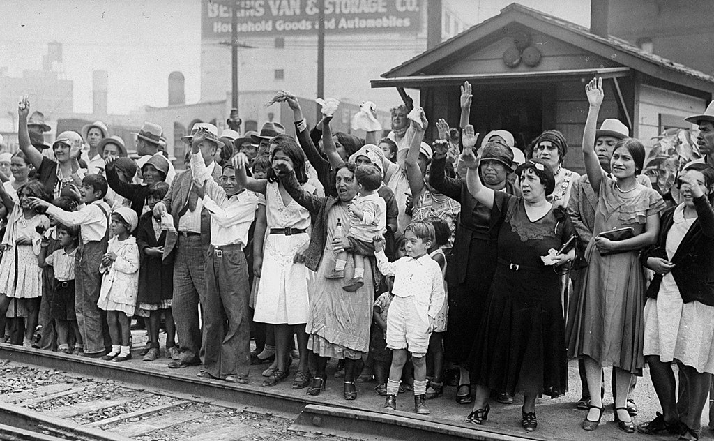 Relatives and friends wave goodbye to a train carrying 1,500 persons being expelled from Los Angeles back to Mexico on August 20, 1931.
