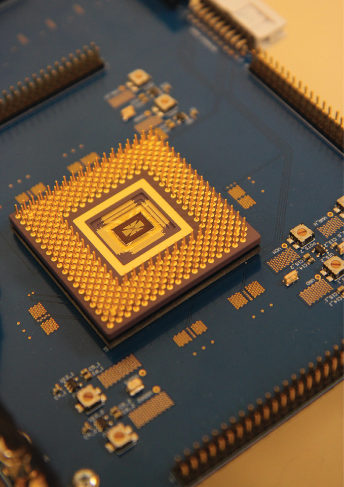 Integrating memristor arrays with CMOS circuitry to build efficient edge AI chips