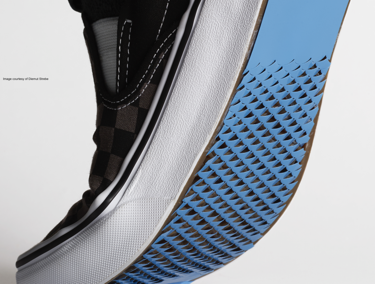 Bioinspired kirigami metasurfaces as assistive shoe grips