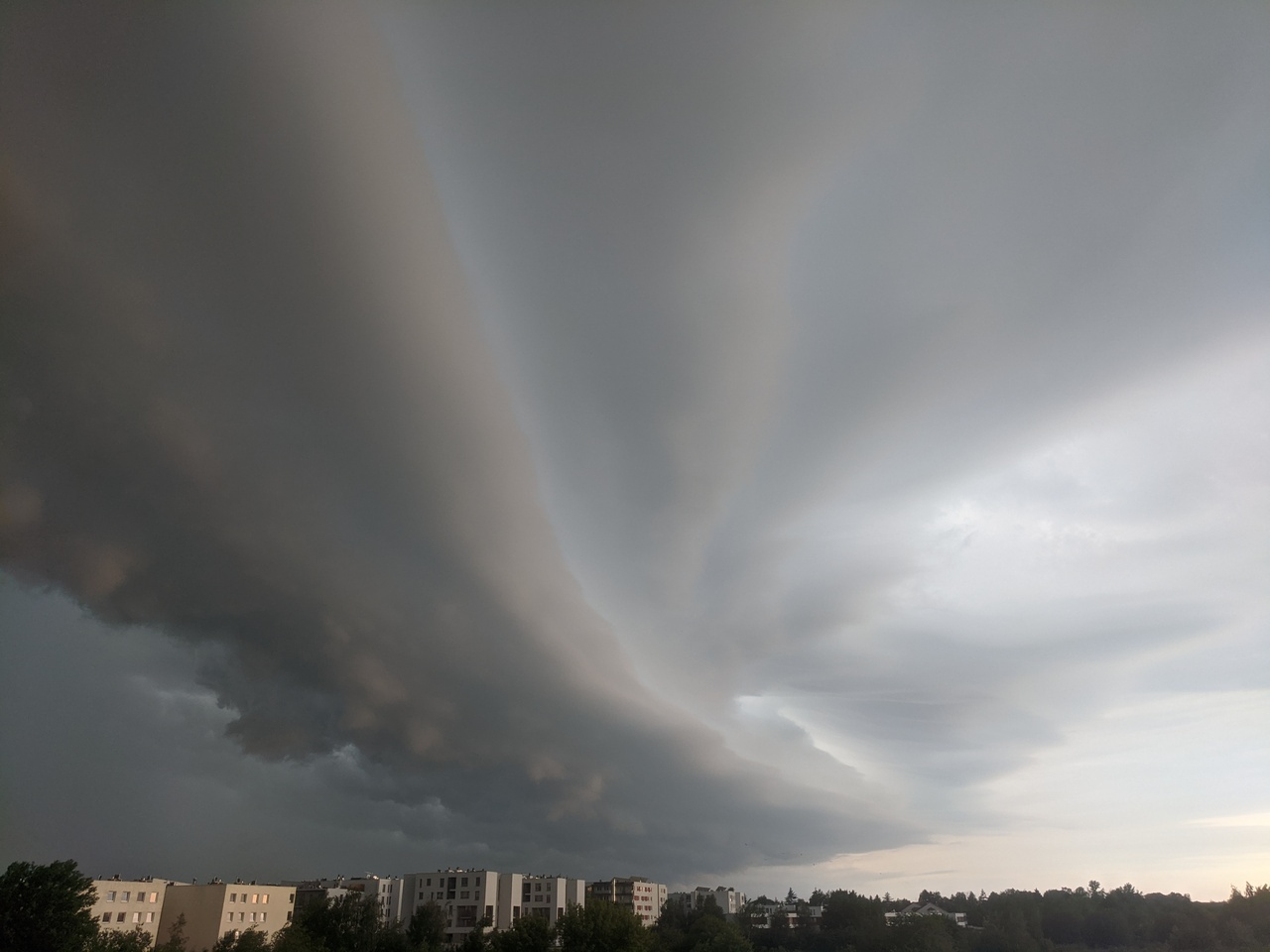 Large-scale dynamics moderate impact-relevant changes to organised convective storms