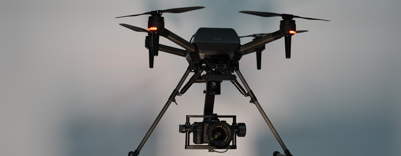 Elevating Autonomous Health Assessment to Combat Aging Infrastructures:  Aerial Drone Photography Unveils Millimeter-Scale Bridge Deflections