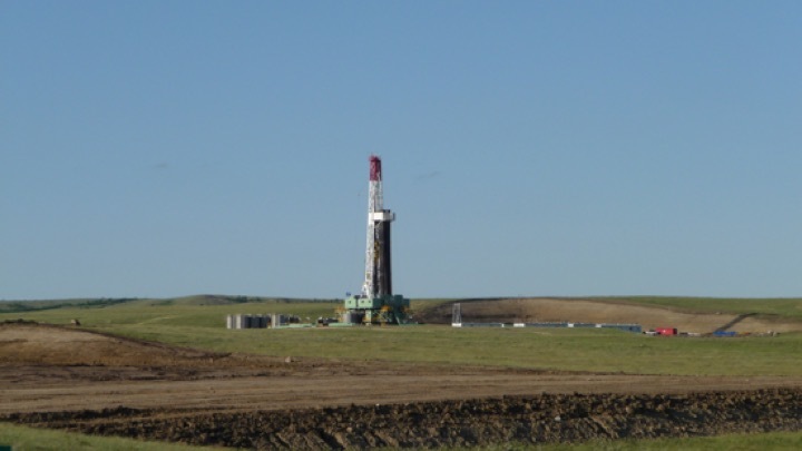 The Effect of Oil and Gas Price and Price Volatility on Rig Activity in Tight Formations and OPEC Strategy