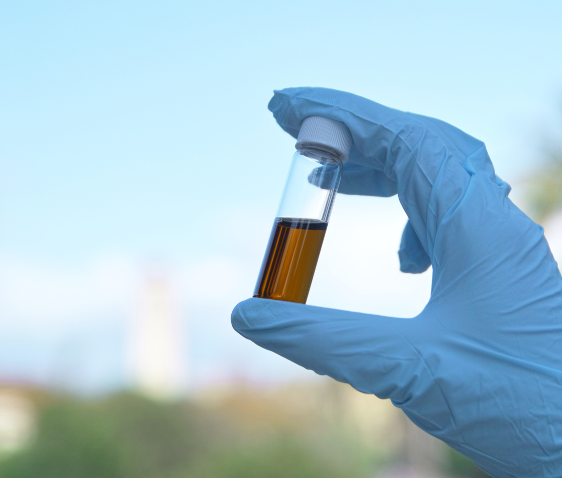 Designing New Organic Molecules as Electrolyte Solvents for Realistic Lithium Metal Batteries