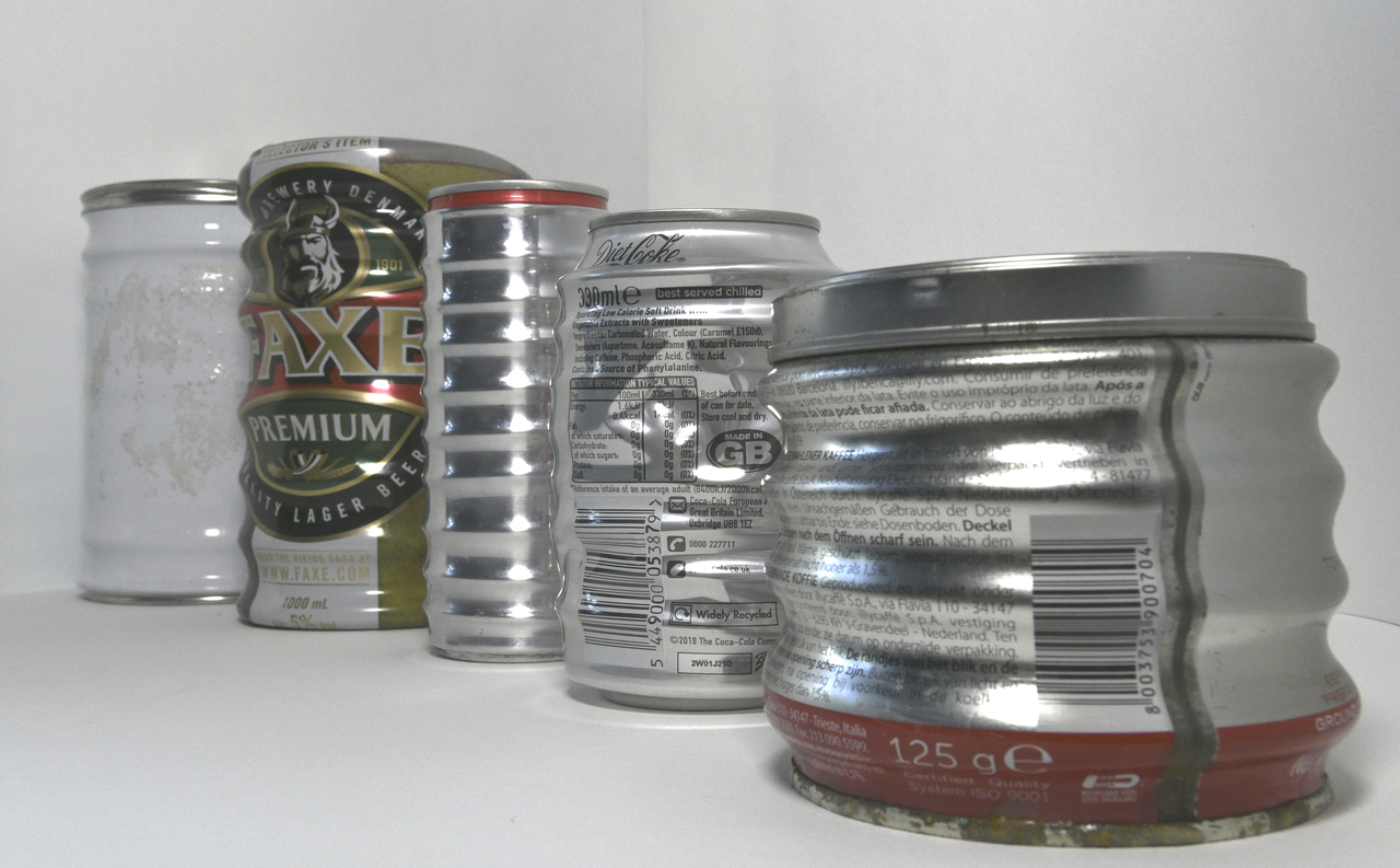 Crushing soda cans and the mathematics of corrugation formation